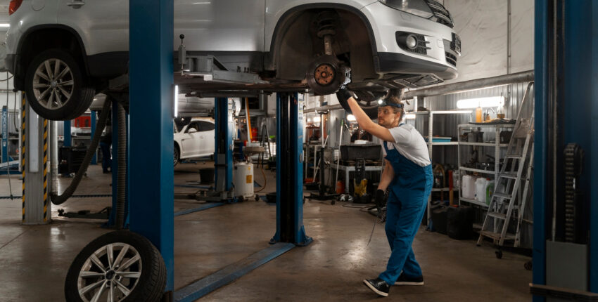Mechanic overseeing car maintenance